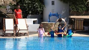 Seasonal outdoor pool, open 10:00 AM to 7:00 PM, pool umbrellas
