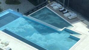 Indoor pool, seasonal outdoor pool, pool umbrellas, sun loungers