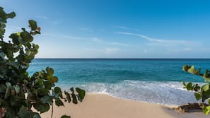 Beach nearby, white sand, beach umbrellas, beach towels