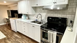Microwave, dishwasher, coffee/tea maker, cookware/dishes/utensils