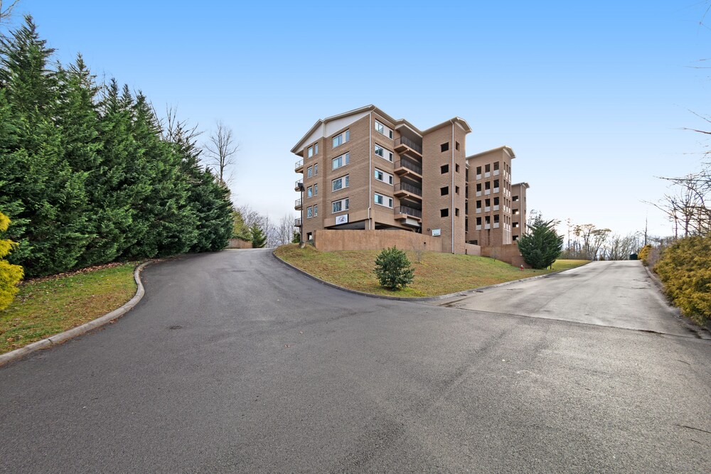 Luxury condo w/ forest & mountain views, a private balcony, & covered parking!