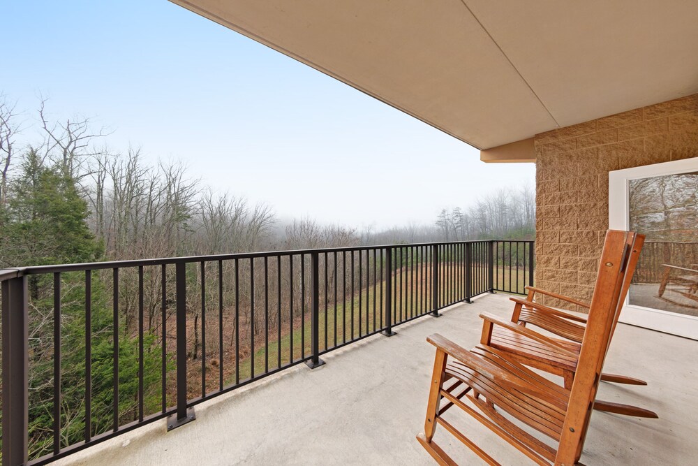 Luxury condo w/ forest & mountain views, a private balcony, & covered parking!