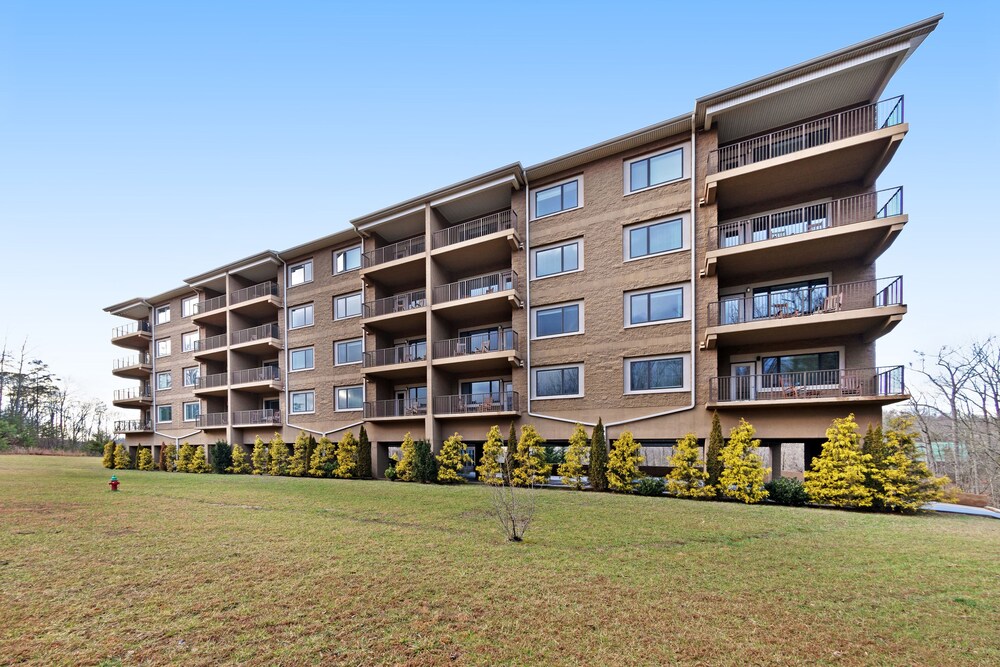 Luxury condo w/ forest & mountain views, a private balcony, & covered parking!