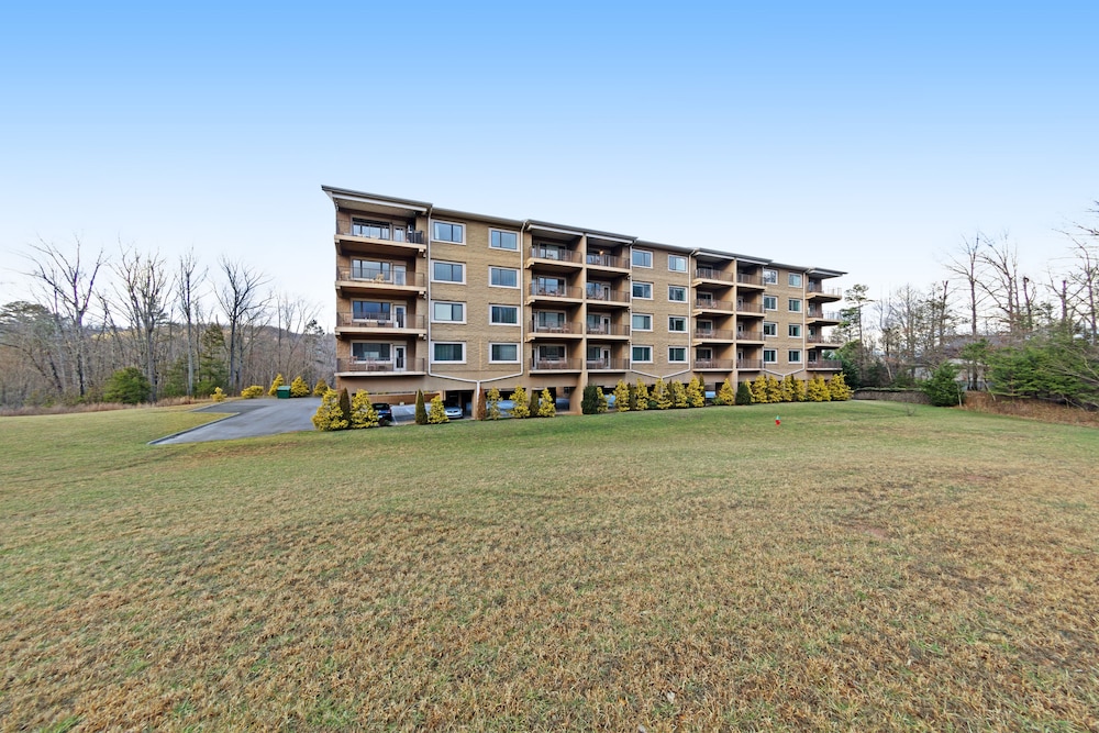 Luxury condo w/ forest & mountain views, a private balcony, & covered parking!