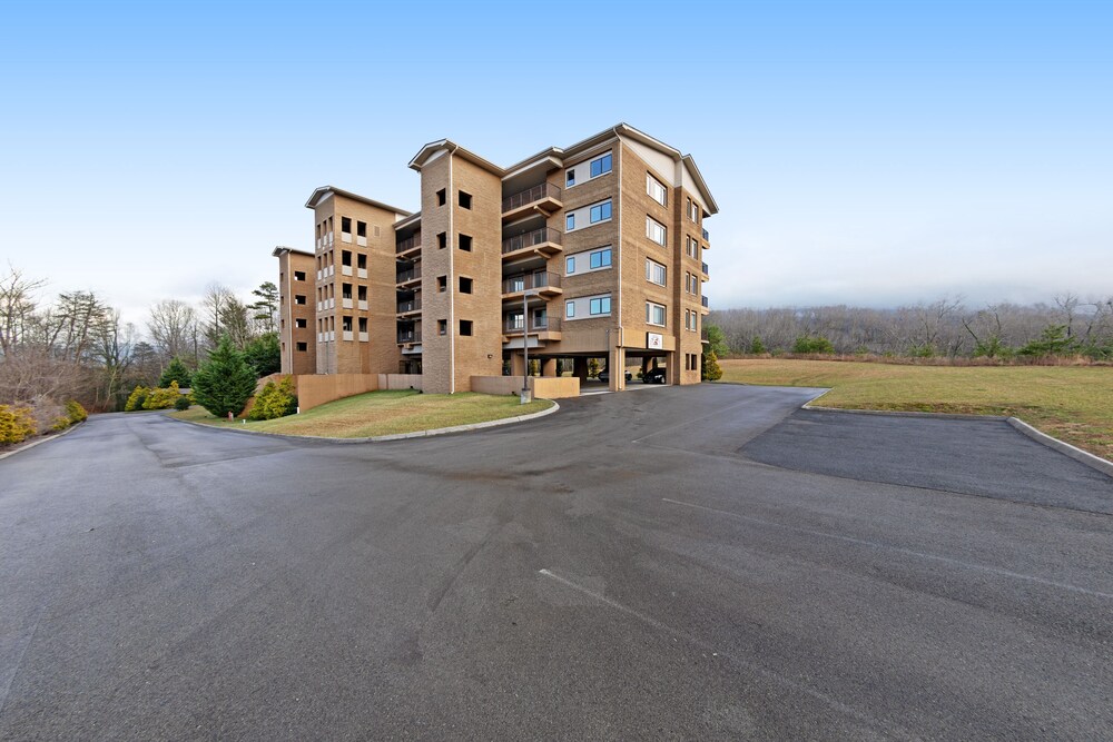 Luxury condo w/ forest & mountain views, a private balcony, & covered parking!