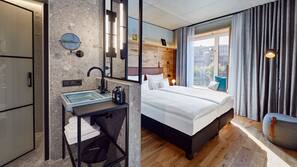 Down comforters, free minibar, in-room safe, laptop workspace