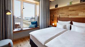Down comforters, free minibar, in-room safe, laptop workspace