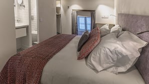 Premium bedding, pillowtop beds, in-room safe, individually decorated