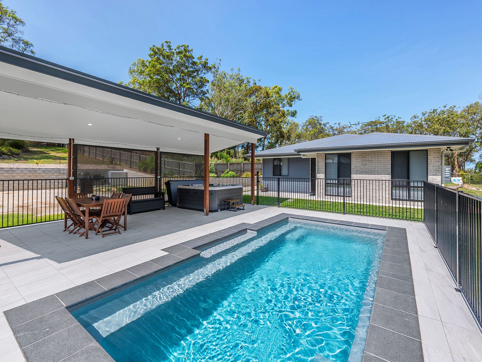 A tranquil bushland retreat with KB, Ducted AC and access to a heated pool.