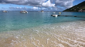 Beach nearby, white sand, beach towels, 3 beach bars