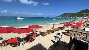 Beach nearby, white sand, beach towels, 3 beach bars