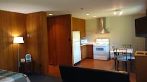 Desk, laptop workspace, blackout drapes, iron/ironing board