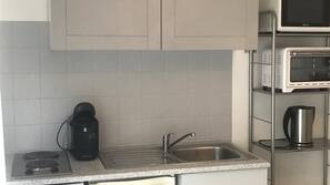Microwave, coffee/tea maker, cookware/dishes/utensils