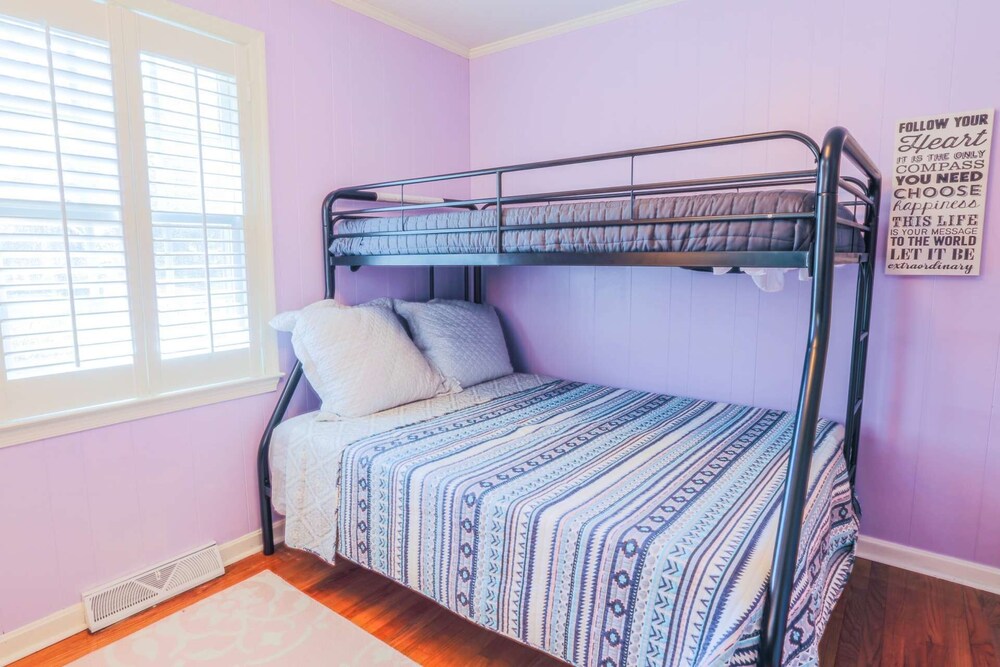 Family & dog friendly home w/ playroom, fenced backyard & bunk beds; 15 min to beach & downtown.