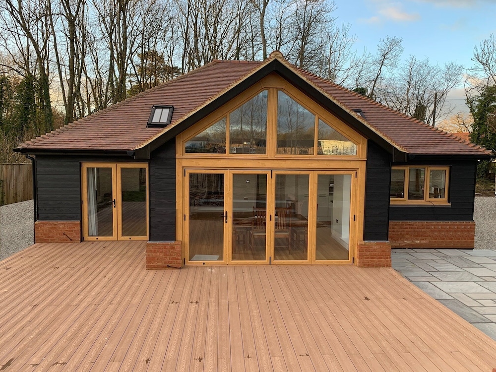 A modern luxury bungalow with an amazing hot tub located in a rural