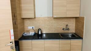 Mini-fridge, coffee/tea maker, electric kettle, coffee grinder