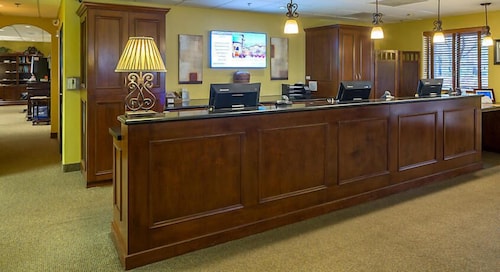 UpScale Resort with Outdoor Heated Pool with a waterslide and a poolside bar, tennis court and gym