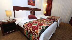 Free minibar items, in-room safe, blackout curtains, iron/ironing board