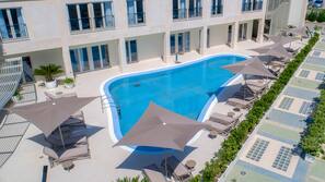 Seasonal outdoor pool, pool umbrellas, pool loungers