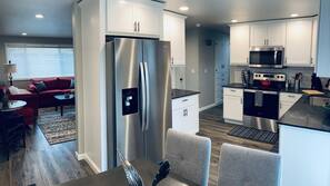 Microwave, dishwasher, coffee/tea maker, cookware/dishes/utensils