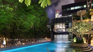 Outdoor pool, open 6:00 AM to 10:00 PM, pool loungers