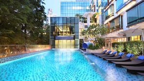 Outdoor pool, open 6:00 AM to 10:00 PM, pool loungers