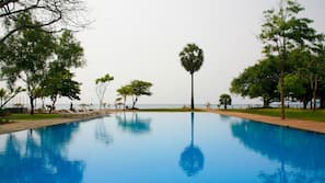 Outdoor pool, open 10:00 AM to 5:00 PM, pool umbrellas