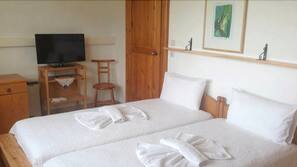 Pillowtop beds, desk, blackout drapes, iron/ironing board