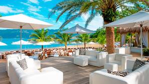 On the beach, white sand, free beach cabanas, sun-loungers