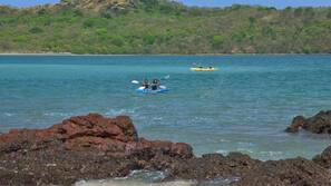 On the beach, white sand, beach towels, kayaking