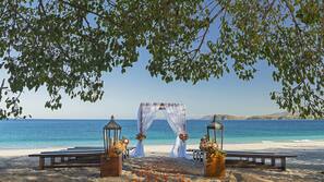 On the beach, white sand, beach towels, kayaking