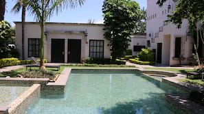 Outdoor pool, pool umbrellas, sun loungers