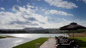 Indoor pool, outdoor pool, pool umbrellas