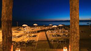 On the beach, beach cabanas, sun-loungers, beach umbrellas