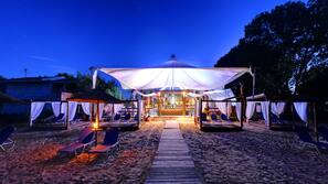 On the beach, beach cabanas, sun-loungers, beach umbrellas
