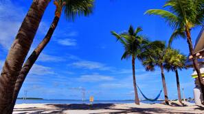 On the beach, sun loungers, beach massages, windsurfing
