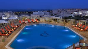 Outdoor pool, open 7 AM to 9:00 PM, pool umbrellas