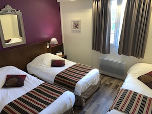 Triple Room, Multiple Beds | 2 bedrooms, individually decorated, individually furnished