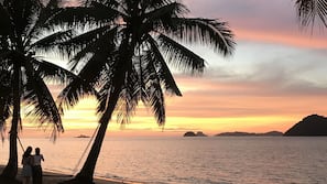 On the beach, sun loungers, beach towels, kayaking