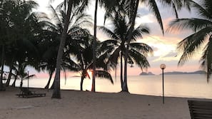 On the beach, sun loungers, beach towels, kayaking