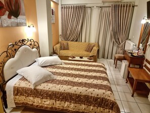 Triple Room | Premium bedding, in-room safe, blackout drapes, iron/ironing board