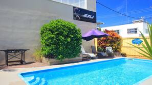 Outdoor pool, pool umbrellas, pool loungers