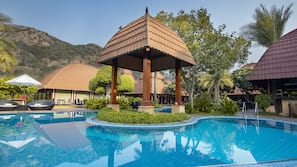 Outdoor pool, open 7:00 AM to 8:00 PM, pool umbrellas