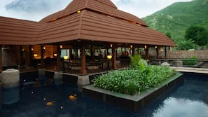 Outdoor pool, open 7:00 AM to 8:00 PM, pool umbrellas