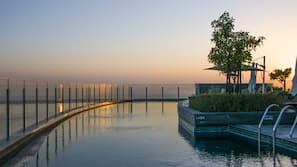 Outdoor pool, pool umbrellas, sun loungers