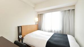 Down comforters, desk, blackout drapes, iron/ironing board