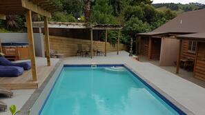 Outdoor pool, open 8:00 AM to 10:00 PM, free pool cabanas