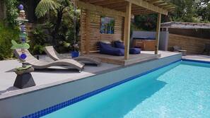 Outdoor pool, open 8:00 AM to 10:00 PM, free pool cabanas