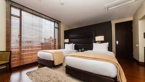 Premium bedding, down comforters, minibar, in-room safe