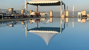 Indoor pool, outdoor pool, pool umbrellas, pool loungers